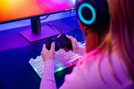 Girl playing a video game she's addicted to